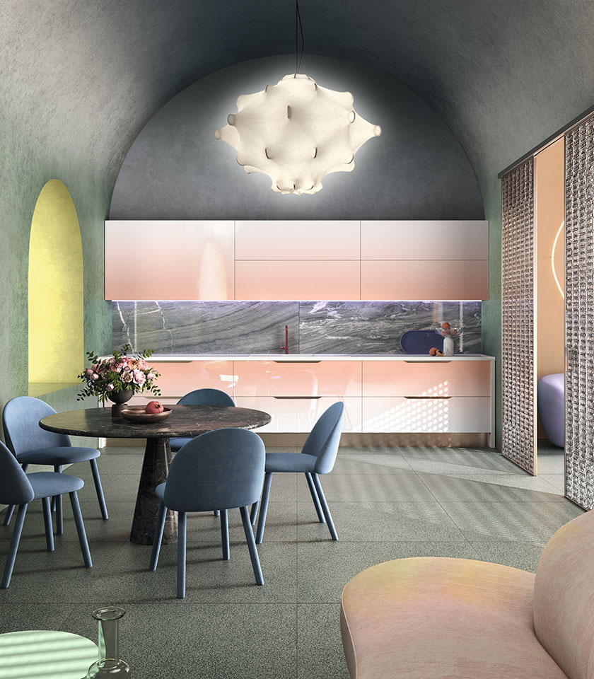 Contemporary kitchen with stone-effect surfaces, pastel tones and softly shaped furnishings.