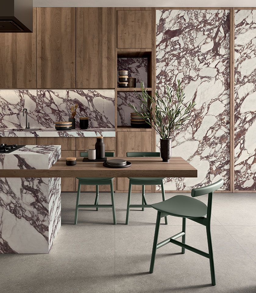 Contemporary kitchen with wood surfaces and coverings from the Noblesse collection, featuring a Viola Arabesque marble effect, paired with Crete stone-effect flooring.