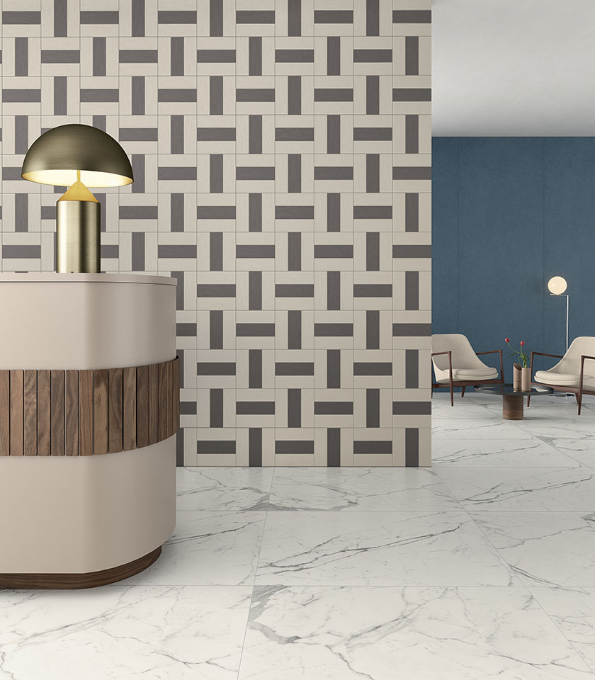 Contemporary reception area with marble-effect porcelain stoneware flooring, a geometric decorative wall and blue wall cladding.