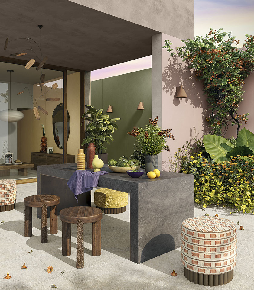 Contemporary outdoor space with flooring from the Pulse collection in Clay stone effect, surfaces in the Shadow shade and elements from the Pigmenti collection in Mauve, Moss and Harvest shades.